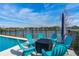 Poolside featuring comfortable seating and lake view at 6871 Forkmead Ln, Port Orange, FL 32128
