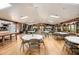 Large community center interior offers tables, chairs, kitchen, fireplace, and plenty of natural light at 71 Crooked Pine Rd, Port Orange, FL 32128