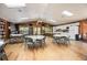 Spacious community center offers tables and chairs for gathering, and a fully-equipped kitchen area at 71 Crooked Pine Rd, Port Orange, FL 32128