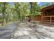 Exterior of the property offers beautiful landscaping, a picnic table, and a walking path at 71 Crooked Pine Rd, Port Orange, FL 32128