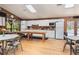 The kitchen area in the community center features white cabinets, a refrigerator, and a large counter at 71 Crooked Pine Rd, Port Orange, FL 32128