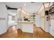 Bright kitchen featuring white cabinets, modern appliances, and laminate flooring at 71 Crooked Pine Rd, Port Orange, FL 32128