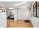 Bright open living room with a sofa, an exit door with a window, and a big closet at 71 Crooked Pine Rd, Port Orange, FL 32128