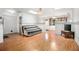 Bright, open-concept living room with hardwood floors, large windows, and natural light at 71 Crooked Pine Rd, Port Orange, FL 32128