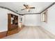 Bright living room featuring neutral carpet, a ceiling fan, and a decorative border at 71 Crooked Pine Rd, Port Orange, FL 32128
