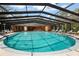 Enclosed pool area has an overhead covering to keep it clean and safe for the community's use at 71 Crooked Pine Rd, Port Orange, FL 32128