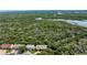 Aerial view overlooking lush green space and waterway near the townhouse complex at 721 Laurel Bay Cir, New Smyrna Beach, FL 32169