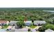 An aerial view of a townhome with charming curb appeal and mature trees surrounding it at 721 Laurel Bay Cir, New Smyrna Beach, FL 32169