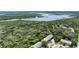 An aerial view of townhouses backing up to scenic waterway and wooded preserve at 721 Laurel Bay Cir, New Smyrna Beach, FL 32169