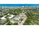 Aerial perspective of townhomes with a coastal city skyline and ocean view in the distance at 721 Laurel Bay Cir, New Smyrna Beach, FL 32169