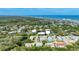 Overhead view of homes near the coast with convenient access to the beach, offering a relaxed and desirable living environment at 721 Laurel Bay Cir, New Smyrna Beach, FL 32169