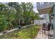 Cozy backyard featuring lush greenery and patio area, perfect for outdoor relaxation at 721 Laurel Bay Cir, New Smyrna Beach, FL 32169