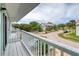 Balcony view featuring a tree-lined street in a well-maintained neighborhood at 721 Laurel Bay Cir, New Smyrna Beach, FL 32169