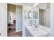 Bathroom vanity and mirror are visible from the hallway, creating an open, airy feel at 721 Laurel Bay Cir, New Smyrna Beach, FL 32169