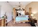 Luxurious bedroom features unique sculpted bed posts, vaulted ceiling, and neutral paint at 721 Laurel Bay Cir, New Smyrna Beach, FL 32169