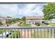 Balcony view of residential street and blue-grey condominiums at 721 Laurel Bay Cir, New Smyrna Beach, FL 32169