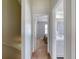 Hallway view leading to bedroom and bathroom with neutral paint and carpet at 721 Laurel Bay Cir, New Smyrna Beach, FL 32169