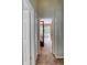 Hallway view leading to a bedroom with slider access to a balcony at 721 Laurel Bay Cir, New Smyrna Beach, FL 32169