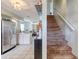 View of kitchen, staircase, and living area, creating an open floorplan at 721 Laurel Bay Cir, New Smyrna Beach, FL 32169
