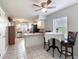 Open-concept design showcasing the kitchen, dining area, and entryway at 721 Laurel Bay Cir, New Smyrna Beach, FL 32169