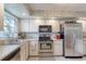Well-equipped kitchen featuring stainless steel appliances and light-colored cabinetry at 721 Laurel Bay Cir, New Smyrna Beach, FL 32169
