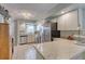 Functional kitchen featuring stainless steel appliances, light countertops, and ample cabinet space at 721 Laurel Bay Cir, New Smyrna Beach, FL 32169