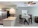 Eat-in kitchen with breakfast bar, stainless steel appliances, and dining table at 721 Laurel Bay Cir, New Smyrna Beach, FL 32169