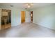Bedroom with neutral carpet, walk-in closet, and ensuite bathroom at 733 E Ohio Ave, Deland, FL 32724