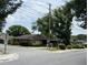 Charming single-story home featuring a mature landscaped yard with great street visibility and curbside appeal at 733 E Ohio Ave, Deland, FL 32724