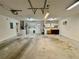 Spacious two-car garage featuring laundry hookups and storage cabinets at 733 E Ohio Ave, Deland, FL 32724