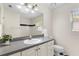 Clean and well-lit bathroom with a vanity, toilet, and combination shower and tub at 802 Royal Oak Ct, Deland, FL 32724