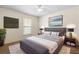 Tastefully decorated bedroom with carpet flooring, ceiling fan, and a large window at 802 Royal Oak Ct, Deland, FL 32724