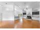 Spacious living area featuring laminate flooring, built-in shelving, a fireplace, and an open concept design at 802 Royal Oak Ct, Deland, FL 32724