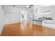 Large living room featuring laminate flooring, high ceilings, a ceiling fan, and an open layout to the kitchen at 802 Royal Oak Ct, Deland, FL 32724