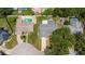 Aerial view of a house shows the roof, driveway, and a small part of the backyard, with neighboring properties at 833 Lucerne Cir, Ormond Beach, FL 32174