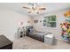 Bedroom featuring a window, closet access, ceiling fan, and carpeted flooring at 833 Lucerne Cir, Ormond Beach, FL 32174