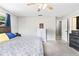 Comfortable bedroom features a ceiling fan and neutral colors with a light and airy feel at 833 Lucerne Cir, Ormond Beach, FL 32174