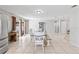 Bright dining area features sliding glass doors, tile floors, and plenty of room for entertaining at 833 Lucerne Cir, Ormond Beach, FL 32174