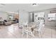 Bright dining room area with rustic table, chairs, and bench and easy access to kitchen and living room at 833 Lucerne Cir, Ormond Beach, FL 32174