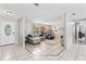 Bright entryway with tile flooring, opening to a living area and a view of the home's layout at 833 Lucerne Cir, Ormond Beach, FL 32174