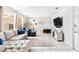 Comfortable living room featuring neutral decor, a plush sofa, and a large flat-screen television at 833 Lucerne Cir, Ormond Beach, FL 32174