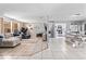 Bright, open-concept living space with tile flooring, a spacious layout, and easy access to the kitchen at 833 Lucerne Cir, Ormond Beach, FL 32174