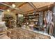A craft room full of shelving, supplies, decorations, and crafting materials, lit by string lights and natural light at 940 Glenwood Rd, Deland, FL 32720
