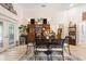 Cozy dining area featuring access to a patio, built-in storage, and neutral decor at 940 Glenwood Rd, Deland, FL 32720