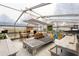 Interior view of a greenhouse with tables, benches, lights and various plants, containers and gardening tools at 940 Glenwood Rd, Deland, FL 32720