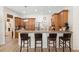 Open kitchen with wood cabinets, stainless appliances, and barstool seating at 940 Glenwood Rd, Deland, FL 32720