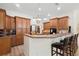 Open kitchen with wood cabinets, stainless appliances, and barstool seating at 940 Glenwood Rd, Deland, FL 32720