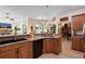 Kitchen area with stainless steel appliances, a sink, and an open view to the Gathering room at 940 Glenwood Rd, Deland, FL 32720