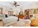 Bright main bedroom featuring a ceiling fan, decorative accents, and ample natural light at 940 Glenwood Rd, Deland, FL 32720