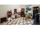 Office space with large window offering lots of natural light, unique furnishings, and neutral decor at 940 Glenwood Rd, Deland, FL 32720